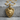 Wolf Shield Pendant, gold vermeil, product photo on stone background