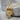 Skeleton Middle Finger Pendant, gold vermeil, front view on stone