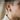 Side view of a person wearing the oxidized silver veiled skull earring showing delicate birdcage lace drop