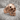 Stitched Skull Ring, rose gold, product photo on porous stone