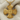 Beaded Celtic Cross Pendant, gold vermeil, front view on fabric