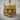 Horned Oni Mask Ring, gold vermeil, front view on wood surface