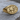 Flavia Felix Lion Ring, gold vermeil, angled product view on wood