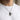 Model wearing handcrafted oxidized silver angel gun pendant necklace on ball chain over white tshirt