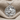 Fox Medallion Pendant, polished silver, product photo on stone base