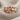Swimming dolphin band ring in rose gold finish on textured linen