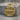 Swamp alligator pendant, gold vermeil, product photo on stone base
