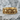 Skull and Crossbones Ring, gold vermeil, product photo on stone surface