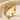 Interlocking skeleton hands ring, gold vermeil, angled front view on stone
