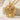 Ribcage Bud Pendant, gold vermeil, product photo on stone surface