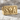 SOA Skull Signet Ring, gold vermeil, angled product photo on stone