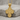 Crucifixion Scene Cross Pendant, gold vermeil, product photo on stone