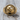 Trepanation Signet Ring, gold vermeil, product photo on wood surface