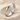 Hammered Posy Ring, polished silver, angled product view on sand