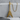 Flying V Electric Guitar Pendant, gold vermeil, product photo on concrete display