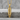 Cross Bullet Skull Pendant, gold vermeil, product photo on stone surface