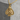 Death Gambler Pendant, gold vermeil, product photo on stone surface