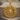 Scorpio Medallion Pendant, gold vermeil, product photo on wood surface