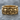 Crossed Bones Skull Ring, gold vermeil, product photo on stone surface