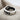 Lotus Yin Yang Koi Ring, oxidized silver, angled front view on fabric