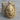 Native Chief Headdress Pendant, gold vermeil, front view on wood