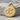 Double Mars Pendant, gold vermeil, product photo on stone block