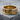 Interlocking Hearts Ring in gold vermeil, front view on stone surface