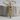 Hand Saw Pendant, gold vermeil, front view on wood block