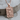 Norse Knotwork Wolf Pendant, rose gold, front view on wood base