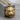 Snarling Tiger Head Pendant, gold vermeil, front view on wood block