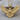 Soaring owl pendant, gold vermeil, front view on wood block