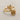Rose bypass ring in gold vermeil, product photo on fabric