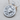 Scorpio Zodiac Medallion Pendant, polished, angled view on wood surface with chain