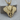 Layered Elephant Pendant in gold vermeil, front view on wood block