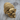 Mustache Skull Ring, gold vermeil, three-quarter view on wood