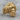 Hercules Lion Ring, gold vermeil, angled front view on wood