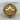 Compass Skull Ring, gold vermeil, front view on wood