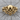 Tribal Biker Skull Ring, gold vermeil, front view on wood surface