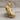 Draped Praying Hands Pendant, gold vermeil, product photo on wood block