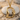 Twin Bird Letter D Pendant, gold vermeil, front view on stone