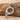 Bird letter P pendant in polished silver on driftwood