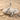 Bird Letter H Pendant, polished, product photo on sand