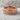 Chiseled bark band ring, rose gold finish, product photo on stone