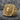 Lion Eagle Signet Ring, gold vermeil, angled view on rock surface