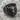 Bull Signet Ring, black rhodium, angled view on rock surface