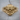 Armored Viking Skull Ring, gold vermeil, front view on wood background