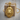 Fleur-de-Lis Lion Pendant, gold vermeil, front view on wood block