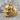 Tengu Mask Ring, gold vermeil, product photo on stone surface
