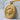 Genbu Guardian Medallion Pendant, gold vermeil, angled front view on block
