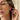 Studded Gothic Cross Earring, rose gold, worn on model ear